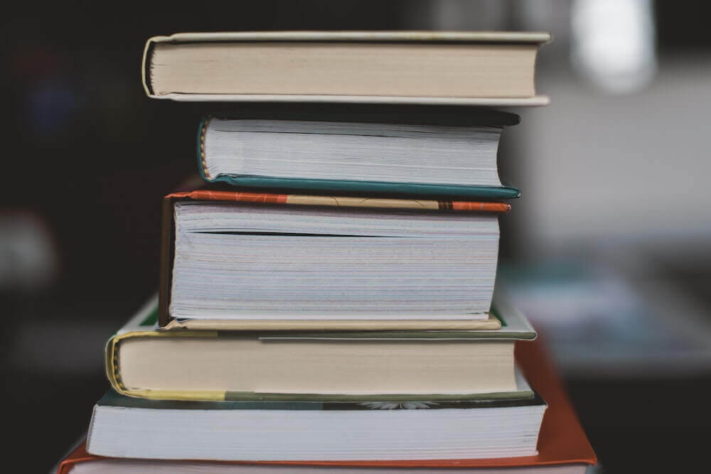 Best CA Performance Test Book by BarMD atop a stack of books